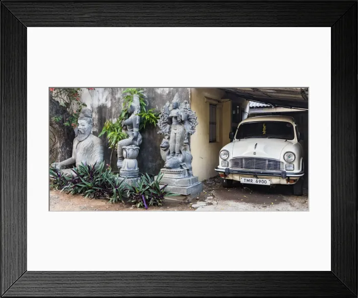 Framed Print : Granite stone carvings and an Ambassador car in a garden at Mamallapuram in Tamil Nadu, India