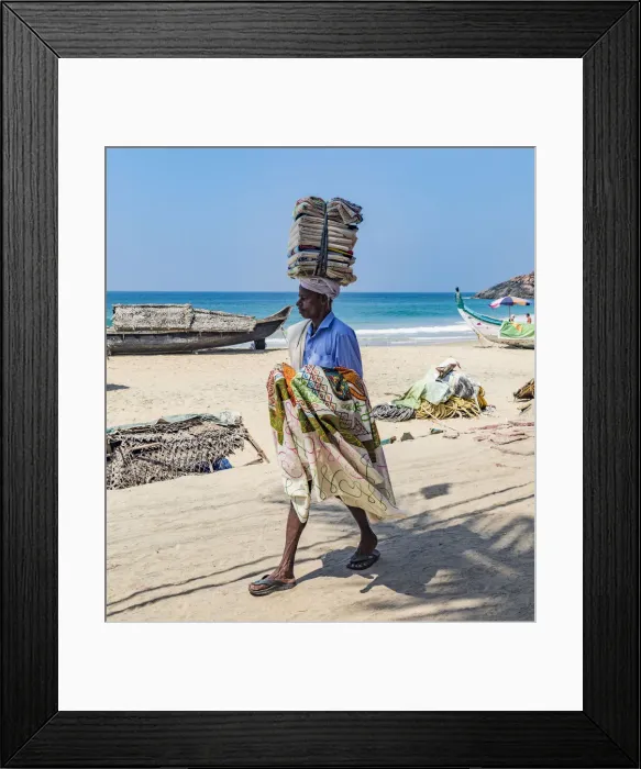Framed Print : A salesman looking for customers at the resort of Kovalam in Kerala, India