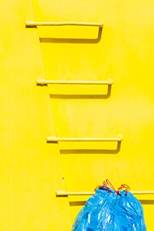 Yellow Prints: A colourful rubbish skip in Elche, Spain