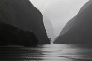 : Dark clouds and misty weather in Doubtful Sound, Southland in New Zealand