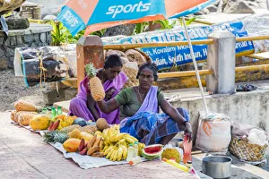 A lady selling fruit at the resort of Kovalam in Kerala, India
