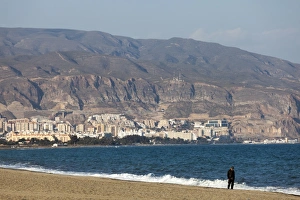 A lone figure on the beach at Roquetas de Mar in Spain