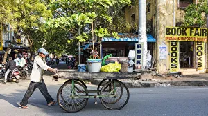 India Prints: A man pushing a cart in Puducherry (Pondicherry), India