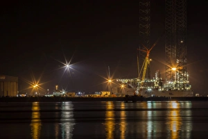 Reflection Prints: A night-time view of the fabrication yard at Nigg Point in Scotland