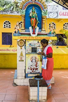 A pilgrim at a Hindu shrine at Mamallapuram in Tamil Nadu, India