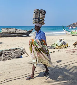 India Prints: A salesman looking for customers at the resort of Kovalam in Kerala, India
