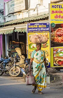 India Prints: A shopper carrying a load on her head at Mamallapuram in Tamil Nadu, India