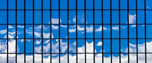 : The sky reflected in a glass-fronted building in Wellington, New Zealand