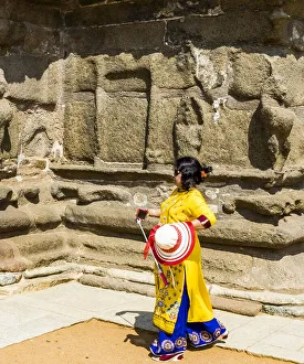 Tamil Nadu Prints: A visitor walking beside Shore Temple at Mamallapuram in Tamil Nadu, India