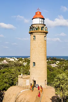 Visitors at the lighthouse at Mamallapuram in Tamil Nadu, India